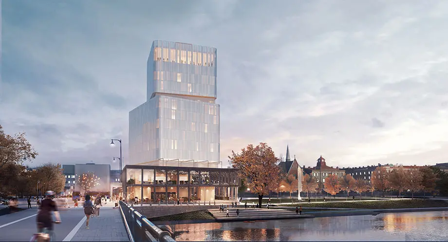 Bilden visar nuvarande förslag sett från Österbro. En hög byggnad i glas ligger intill Nissan. Framför hotellet finns trappor ner till vattnet. 